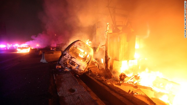 Burned cars are pictured in a highway in Ecatepec near Mexico city, on May 7, 2013.