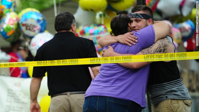 Friends and relatives gather in front of the family house of DeJesus on May 7.