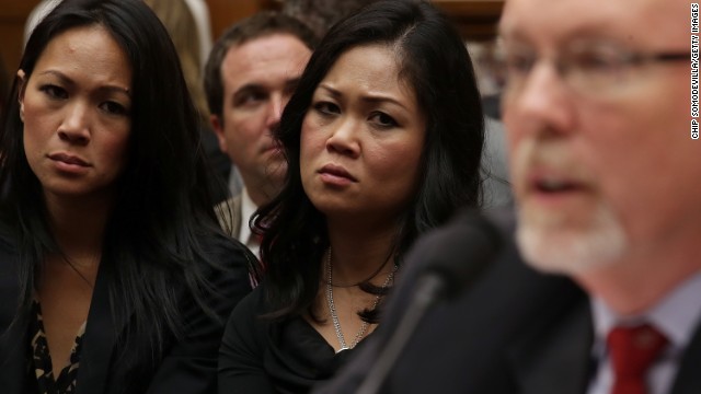 Dorothy Narvaez-Woods, center, listens as Hicks testifies. She is the widow of Navy SEAL Tyrone Woods, who was killed in the attack.