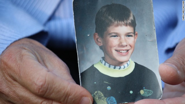 Jacob Wetterling was abducted at gunpoint in October 1989 at age 11 near his home in St. Joseph, Minnesota, near St. Cloud. His mother, holding a photo of her son, remains hopeful that he will be found alive.