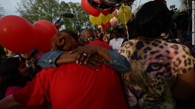 Residents gather outside a community meeting at Immanuel Lutheran Church on Thursday, May 9, to talk about the kidnapping case in Cleveland. Balloons were released as part of the ceremony.
