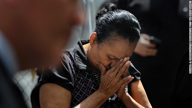 Ada Colon prays during a vigil held in honor of the kidnapping victims in Cleveland on Wednesday, May 8.