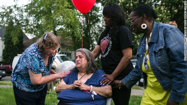 Deborah Knight, the grandmother of kidnapping victim Michelle Knight, participates in a community balloon-release service in Michelle's honor on Thursday, May 9, in Cleveland. Four females were found in a home on Seymour Avenue in the Clark Fulton neighborhood on Monday. Since then, the neighborhood and the nation have wondered how they were held captive without anyone noticing sooner.