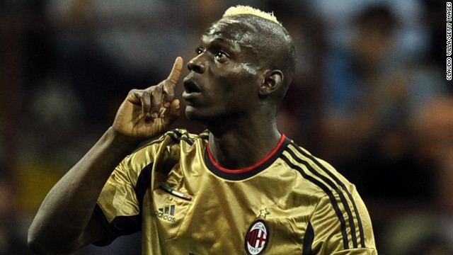 AC Milan's Mario Balotelli reacts to racist abuse from the visiting Roma fans at the San Siro on Sunday. 