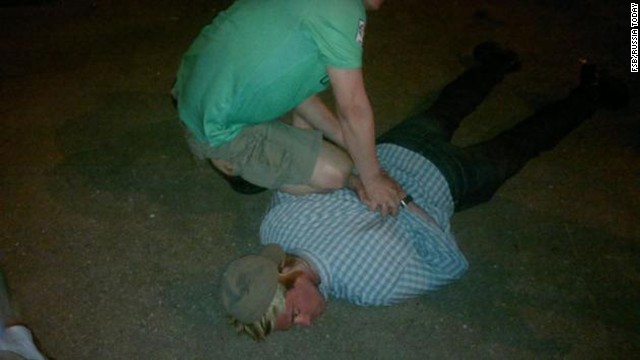 Russia's FSB counterintelligence agency released photos after it said it briefly detained a suspected member of the CIA who was trying to recruit a staff member of one of the Russian special services. Pictured, the man is handcuffed on the ground.