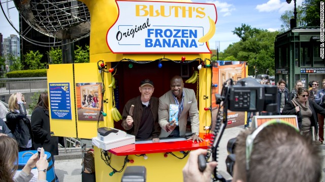 Ron Howard and Terry Crews work the Bluth's Original Frozen Banana Stand in New York on Tuesday.