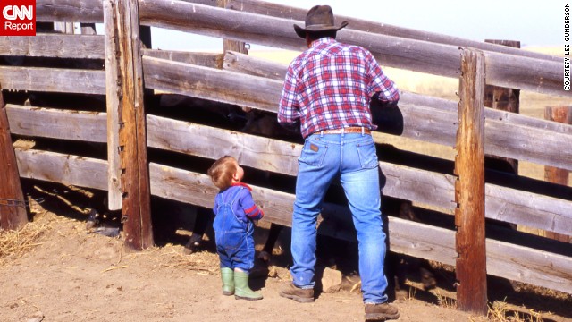 To this day, blue jeans remain the uniform for cowboys young and old. Here, Bruce Beasley and his grandson <a href='http://ireport.cnn.com/docs/DOC-971568'>load cattle on their farm</a> in Patricia, Alberta, in May 2013.