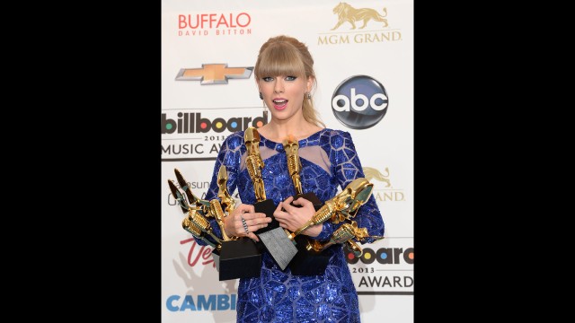 Taylor Swift poses with her Billboard awards.