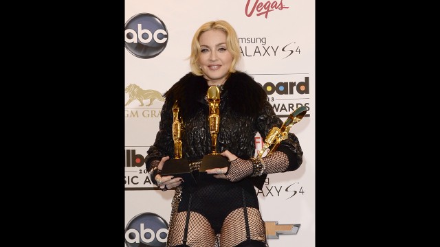 Madonna poses with her awards.