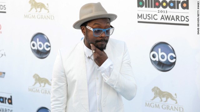 Will.i.am arrives.