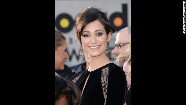 Emmy Rossum arrives.