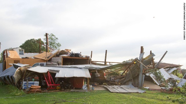 A home in Shawnee, Oklahoma, sits in ruin after being hit by a tornado on Sunday, May 19. Two people have been confirmed dead from the storms as severe weather continues to threaten the Midwest on Monday.