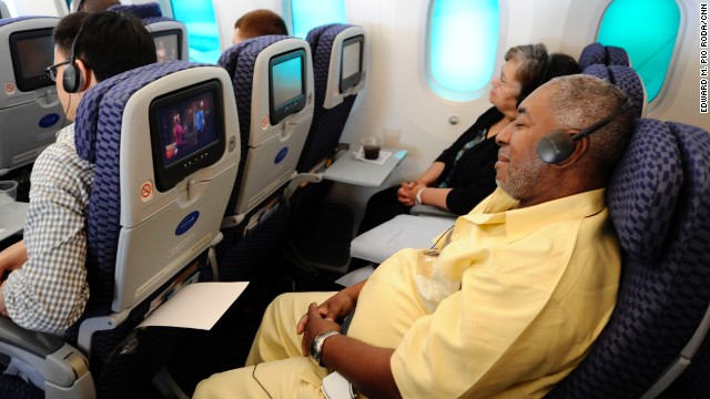 Michael Reynolds of St. Louis, Missouri, reclines during the flight to Chicago.