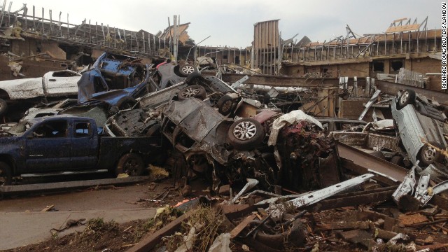 Extensive damage from an EF4 tornado destroyed cars and demolished structures in Moore on May 20.