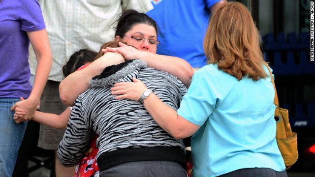 A woman is comforted after the May 20 tornado in Moore.