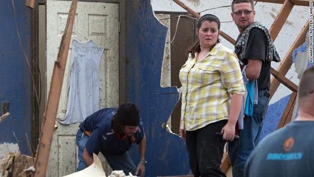 Residents look through the debris in Moore on May 20.