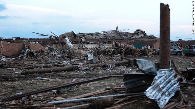 Piles of debris lie around the north side of Plaza Towers Elementary School in Moore on May 21.