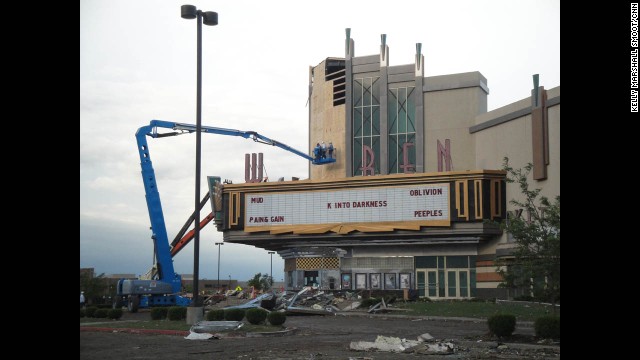 Workers clean up the Warren Movie Theater in Moore, on May 21.