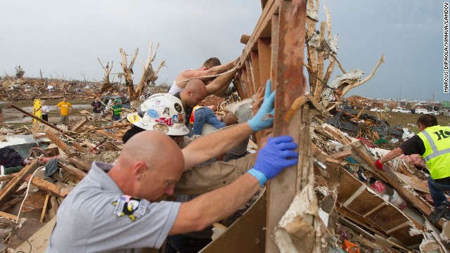 Rescuers dig out a house in Moore, Oklahoma, on Tuesday, May 21, after a massive tornado ripped through the area on Monday, May 20. The storm was part of a tornado outbreak that began in the Midwest and Plains on Sunday, May 19. <a href='http://www.cnn.com/2013/05/20/us/gallery/midwest-weather/index.html'>View more photos of the aftermath in the region.</a>