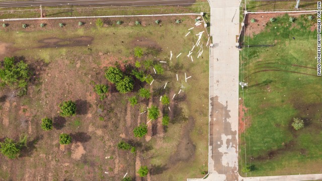 The devastation in Moore was so complete that the mayor said city officials were racing to print new street signs to help guide rescuers and residents through a suddenly twisted and unfamiliar landscape.