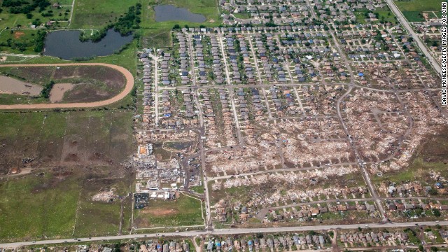 The path of the tornado is clearly visible with dirt and debris painting a wide path across the Oklahoma landscape.