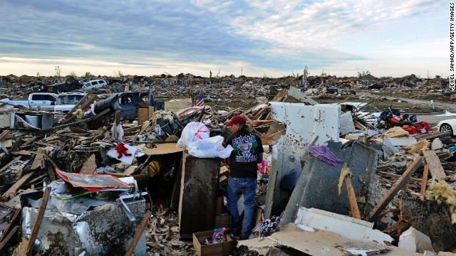 Residents salvage belongings from their demolished homes in Moore on May 21.