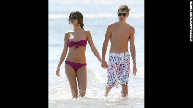 While Selena Gomez's friend Taylor Swift <a href='http://www.usmagazine.com/celebrity-news/news/taylor-swift-hints-she-disapproves-of-justin-bieber-selena-gomez-romance-2013235' >reportedly is not unhappy</a> that Gomez and Justin Bieber have broken up, the pair were plenty happy when they vacationed in Maui in 2011. 