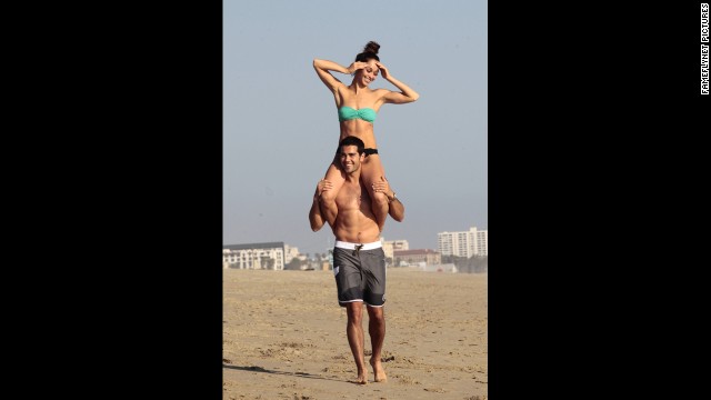 "Dallas" actor Jesse Metcalfe gave his fiancee, Cara Santana, a lift at the beach in Santa Monica, California, in April.