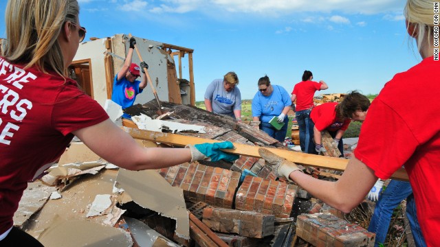 Teachers from Fairview Elementary School help clean up former school counselor Kay Taylor's home in south Oklahoma City, on Wednesday, May 22, two days after an extremely powerful tornado tore through Moore, Oklahoma. View more photos of the aftermath in the region and another gallery of aerial shots of the damage.