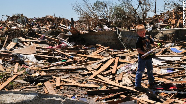 Aidan Fox, 9, was happy to find a baseball bat behind his grandparents' house in Moore on May 22.