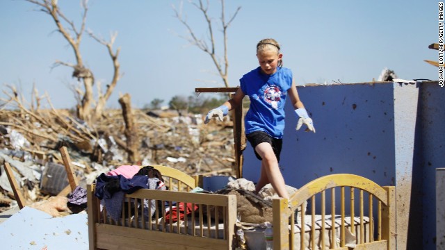 Casey Angle walks on the bunk bed she shared with her sister Sydney, who was among the students killed at Plaza Towers Elementary School during the tornado.