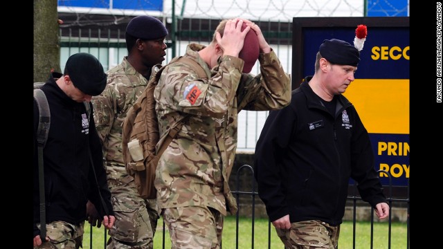 Soldiers walk outside Woolwich Barracks on Thursday, May 23, near where the soldier was killed.