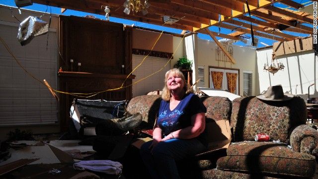 Frieda Stanley sits in what was once her living room. Her Oklahoma City neighborhood was hit by a deadly twister in May 1999 and again on Monday.