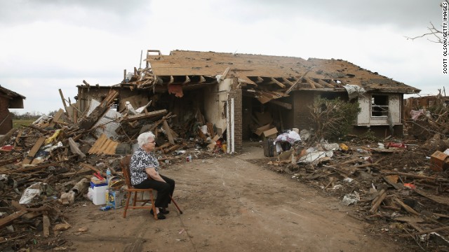 Eunice Lassiter sits in the driveway of a friend's tornado-damaged home on May 25 in Moore.