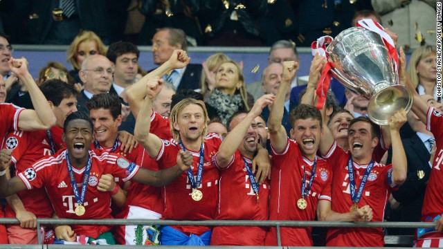 Bayern Munich players lift the trophy as they celebrate winning the UEFA Champions League final after beating Borussia Dortmund 2-1 at Wembley Stadium in London on Saturday, May 25.