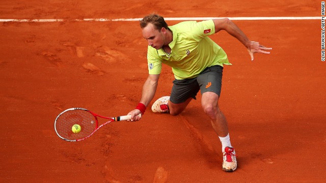 Darcis makes a forehand swing against Llodra on May 26. 