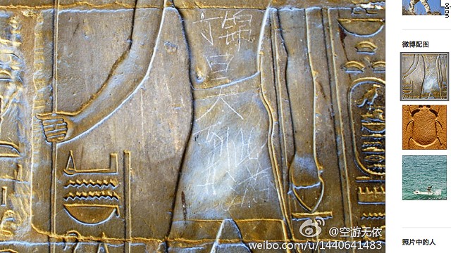 The graffiti was etched across the torso of the figure in the sculpture.