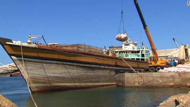 At Mogadishu's seaport, cranes lift goods from the commercial ships and boats lining the harbor. The wide array of imported construction materials, household goods and food are then loaded onto rows of waiting trucks.