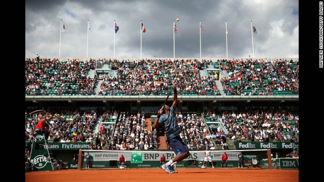 Gael Monfils of France serves against Ernests Gulbis of Latvia on May 29. Monfils beat Gulbis 6-7(5), 6-4, 7-6(4), 6-2.