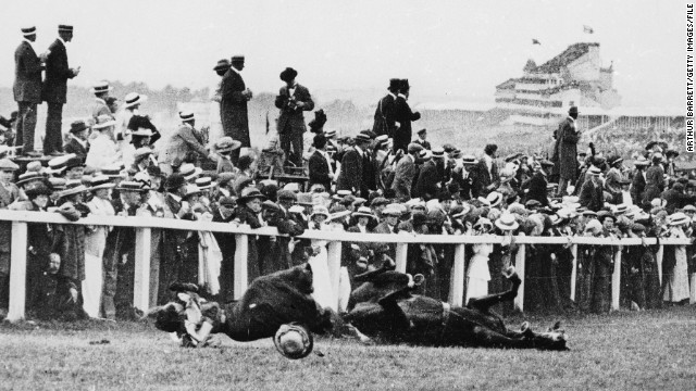 In a shocking instant, Suffragette Emily Davison is knocked to the ground by the King's horse during the 1913 Epsom Derby. Yet take a closer look and you'll see the majority of spectators are instead watching the race.