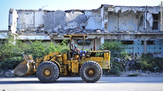 "If you go to Mogadishu the construction is very, very booming," says Osman. Pictured, construction workers in November 2012.