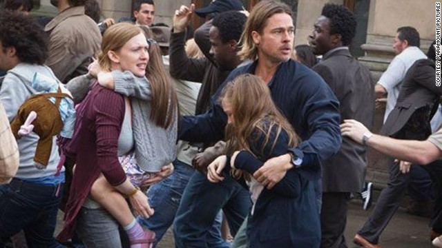 If a family is going to be placed in peril, there must be an equal child-to-parent ratio -- that way everyone is assigned a buddy when all hell breaks lose. Here Mireille Enos as Karen Lane and Brad Pitt as Gerry Lane in "World War Z" each grab hold of a kid.
