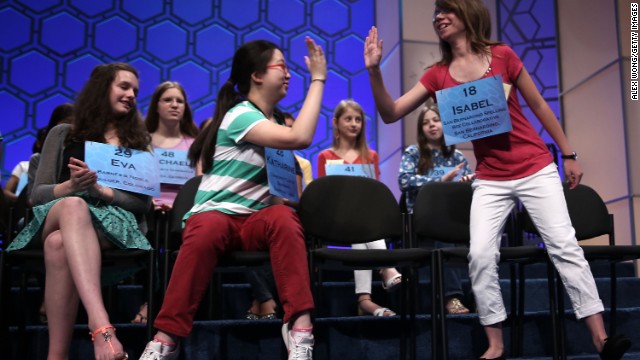 Isabel Cholbi, right, of San Bernardina, California, celebrates after spelling "telergy," in round five on May 30. Telergy is the hypothetical action of one person's thoughts and desires on the brain of a different person via an unknown form of energy transmission. 