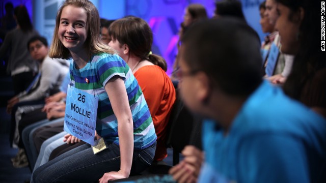 Mollie J. Symons of Halifax, Nova Scotia, Canada, returns to her seat after spelling "ombrology," a branch of meteorology dealing with rain, in round three on May 29.