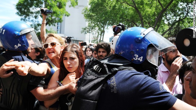 Turkish riot policemen clash with protesters at the Taksim Gezi Park in Istanbul on Tuesday.