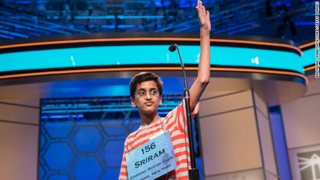 Sriram J. Hathwar, representing New York, waves goodbye after misspelling "ptyalagogue," during the championship round on May 30.