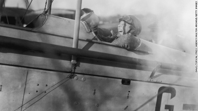 Amelia Earhart laughs before a flight to Northolt, England, in a DH 82 Tiger Moth plane on June 24, 1928.