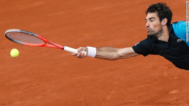 France's Jeremy Chardy stretches to hit the ball against France's Jo-Wilfried Tsonga during their third-round match at the French Open at the Roland Garros stadium in Paris on Friday, May 31. Tsonga beat Chardy 6-1, 6-2, 7-5.