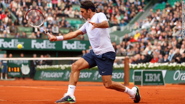 Roger Federer of Switzerland plays a backhand against Julien Benneteau of France on May 31. Federer won 6-3, 6-4, 7-5.