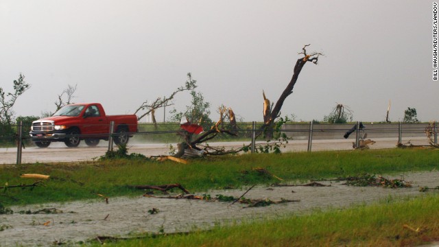 Shredded trees and debris are scattered along Interstate 40 near El Reno, Oklahoma, on May 31. 